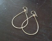 one at a time // medium / 14k yellow gold filled oblong hammered hoops on an ear wire