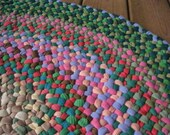 Made To Order Handmade Braided Round Rug in Moss Green and Coral Pink from recycled cotton