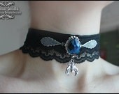 Sleeping Bat - Dark choker with blue gemstone.