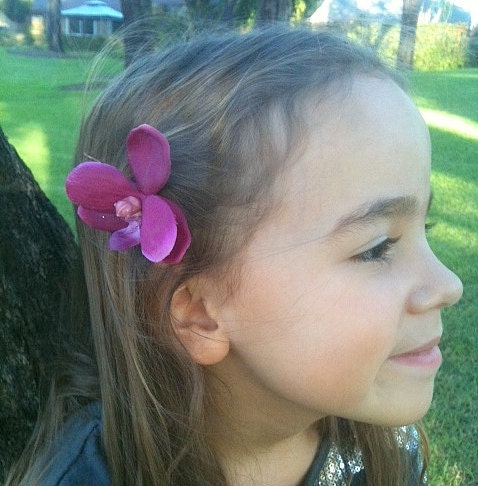Three magenta orchid hair clips