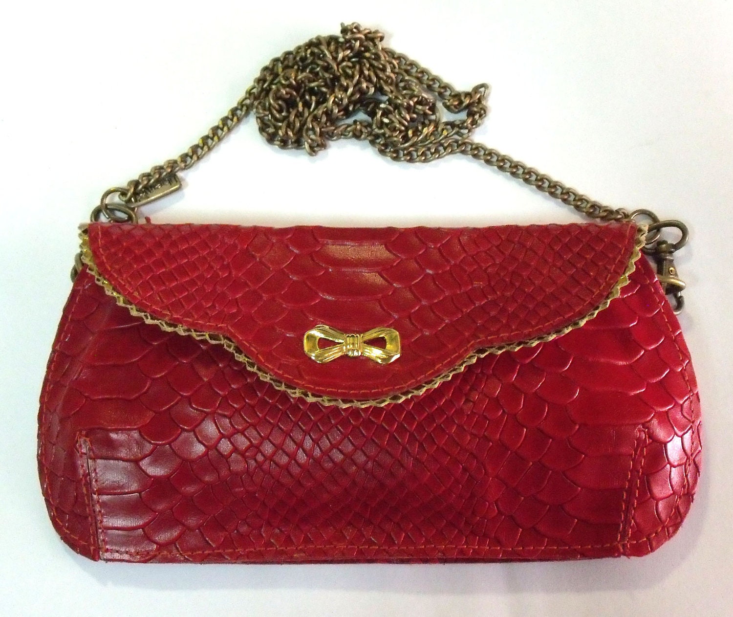 Holiday Sale - Gorgeous red leather clutch with a golden bowtie