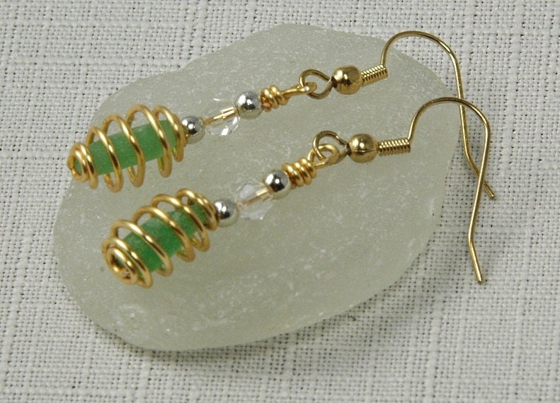 Kelly green sea glass with gold dipped jewelry wire cage, beads, Swarovski crystal