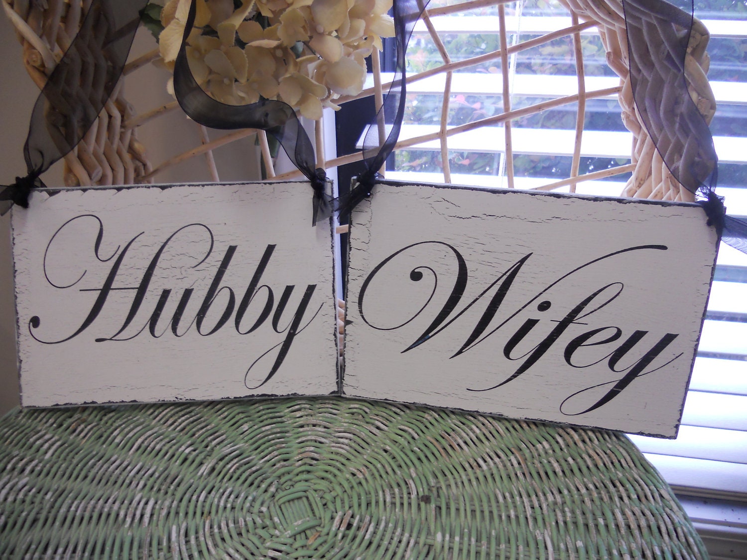 Hubby and Wifey wedding signs with black lettering. Distressed vintage style chair/photo signs..