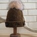 Army green, khaki hat beanie with big Fox pom pom