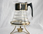 Atomic age glass carafe with metal warming stand / David Douglas signed