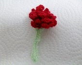 Small red knitted carnation / rose