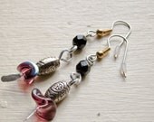 Purple black and silver colored dangle earrings