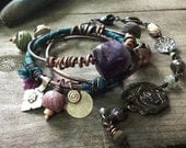 Bohemian gypsy summer bangle stack with wire wrapped copper, amethyst, kuchi, green and purple silk.