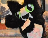 Squitten - A soft, cat-headed, pentapus, octopus-like critter with big green eyes