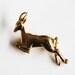 Vintage golden jumping deer brooch