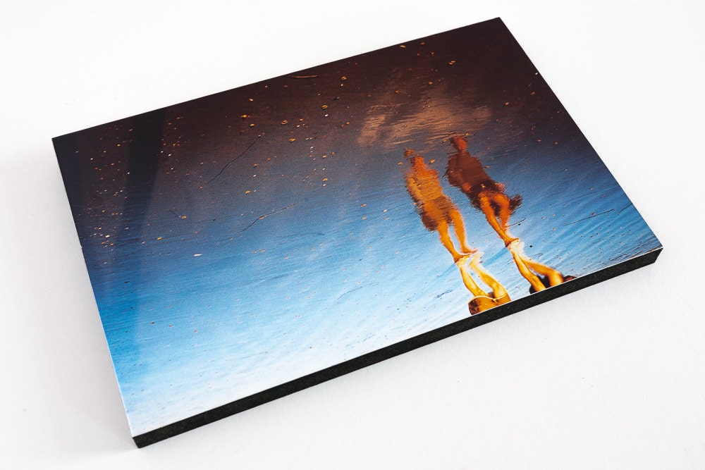 Couple reflected in wet sand.  9" by 6" Wooden block mounted Lomo Photograph. Shot on Film.