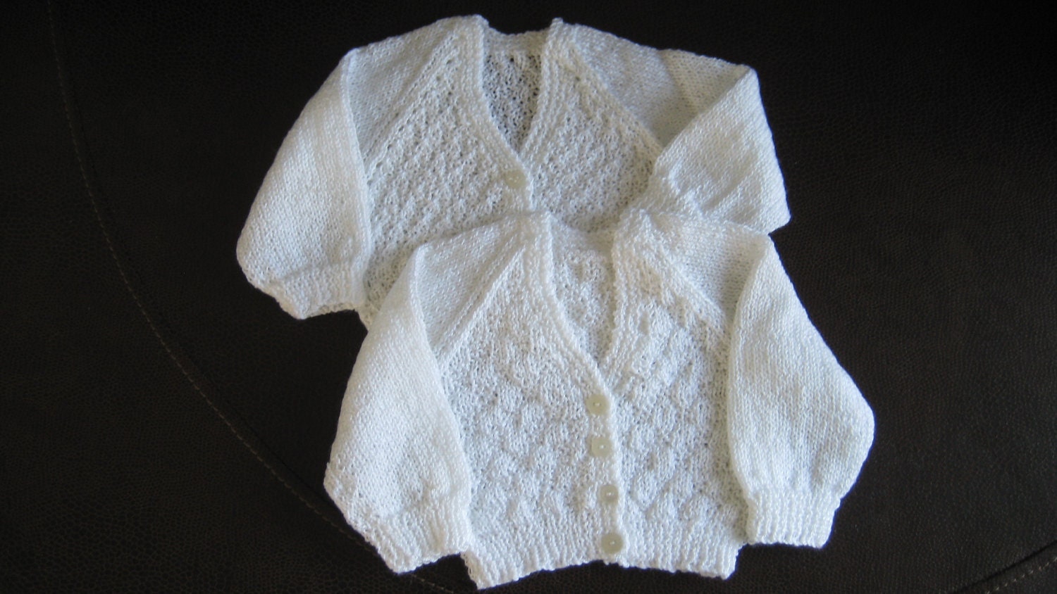 Premature baby cardigans for twins in white cotton.