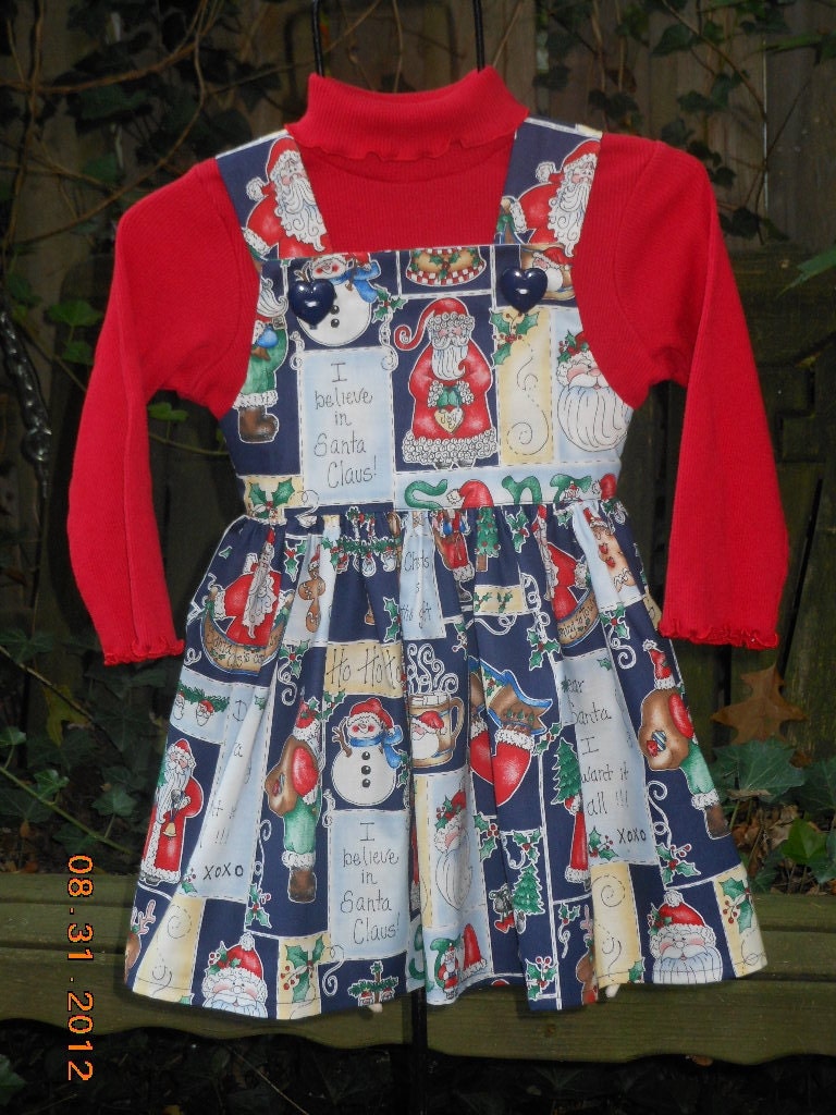 Whymsical Christmas Print Girls Jumper , with adorable Navy Heart-shaped buttons....