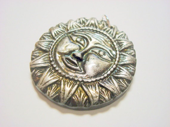 Black, Silver, and Interference Gold Handmade Polymer Clay Sun Pendant