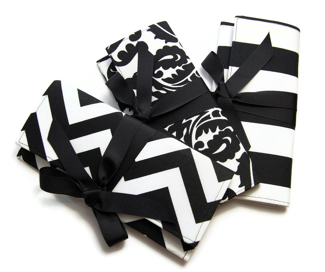 Black and white bridesmaid clutches with black ribbon.  Custom colors available.