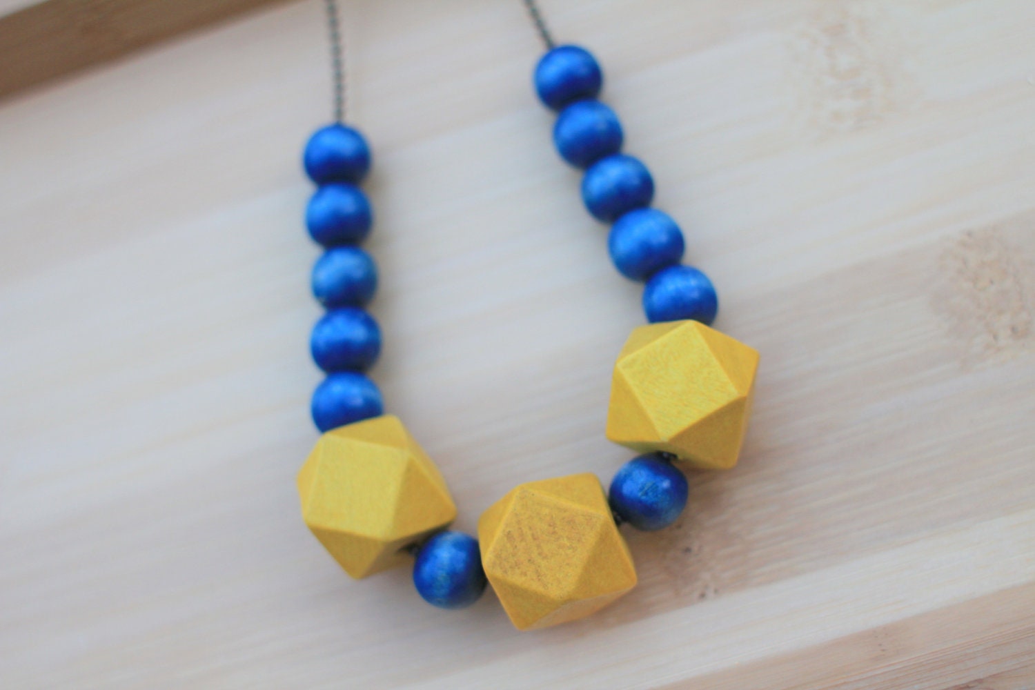 NECKLACE Geometric Wood Beads in Navy and Yellow strung on Antique Brass Ball Chain