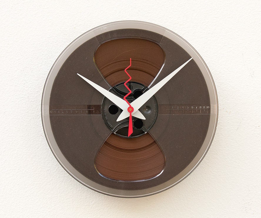 Clock made from a recycled magnetic tape reel