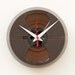 Clock made from a recycled magnetic tape reel