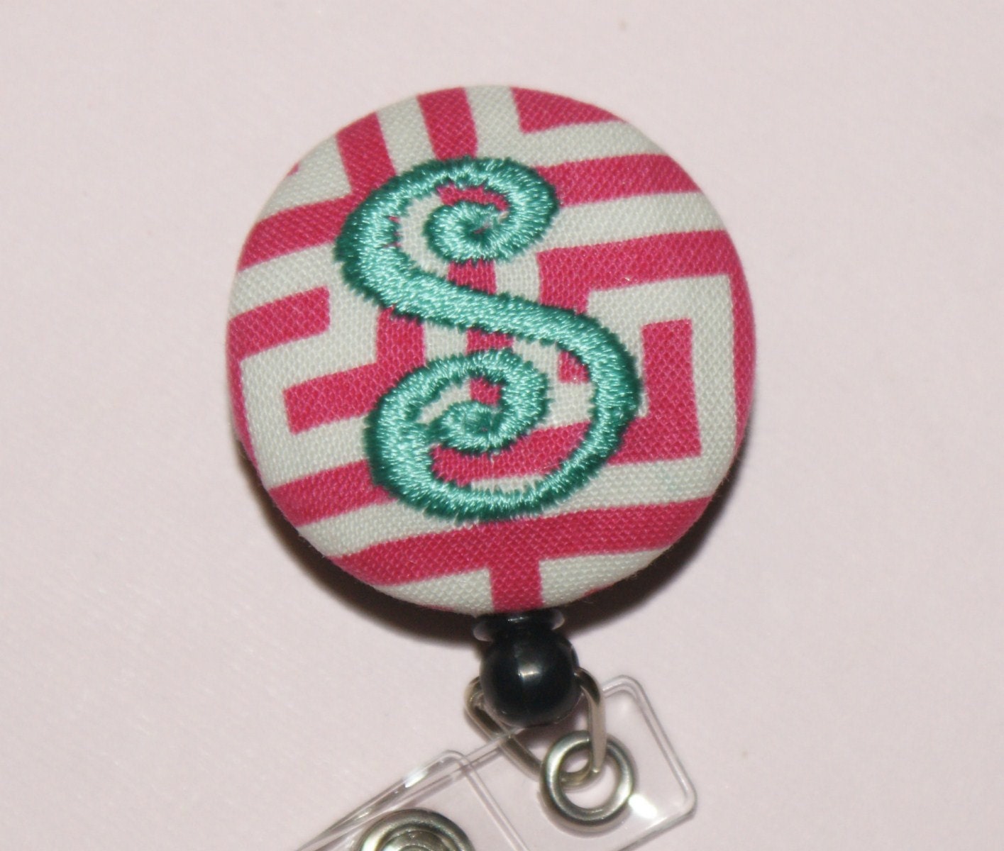 Many fabrics to design YOUR Badge Reel. Monogrammed single letter