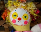 Thalia Muse, a young clown girl with Big Dreams in recycled cashmere and lambswool