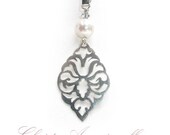 Small Victorian motif pendant on chain