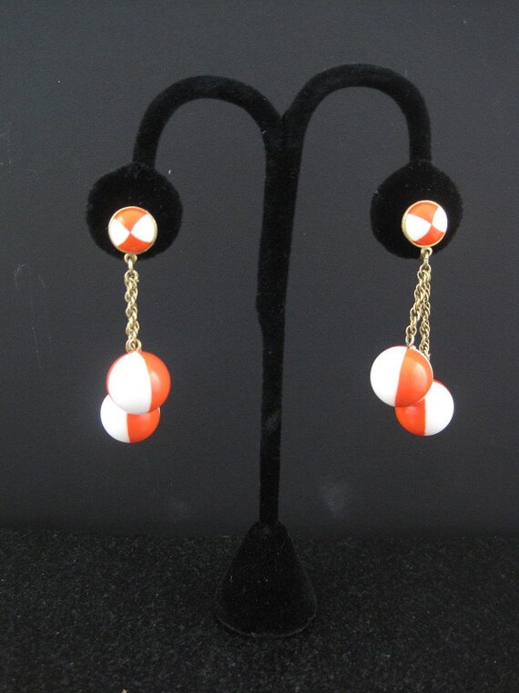 Retro Orange and White Lucite Dangle Ball Clip On Earrings By Trifari