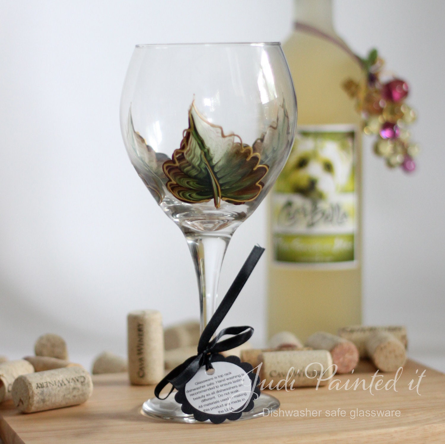 Fall leaves in Thicket Green wine glass that is hand painted.  FREE personalization and dishwasher safe
