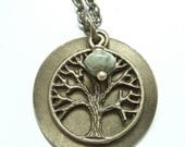 Tree Of Life.  Antique Brass Pendant Necklace with a green glass stone.  Jewelry by Sweet And Simple.