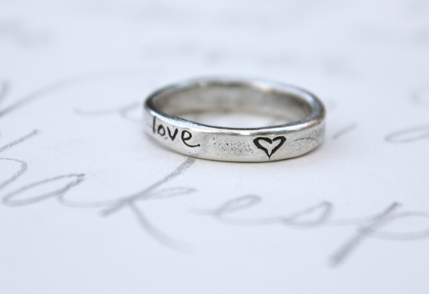skinny silver wedding ring with arrow . recycled silver wedding band . love heart ring . silver stacking band by peacesofindigo