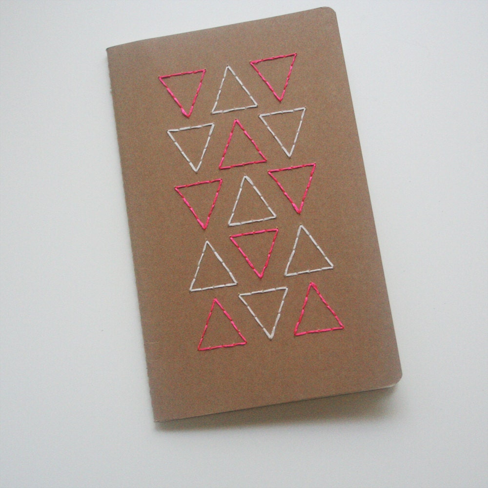 neon pink and white triangles stitched large moleskine, grid paper