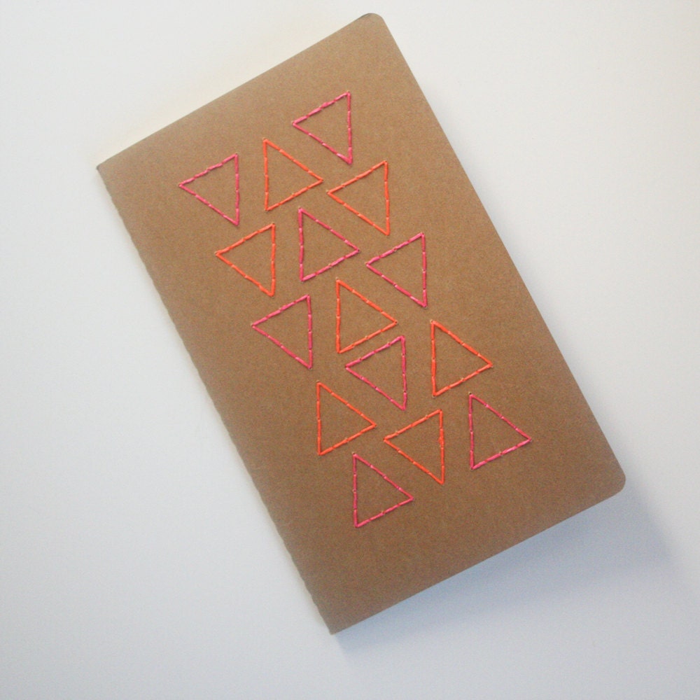 pink and orange neon triangles stitched large moleskine, grid paper