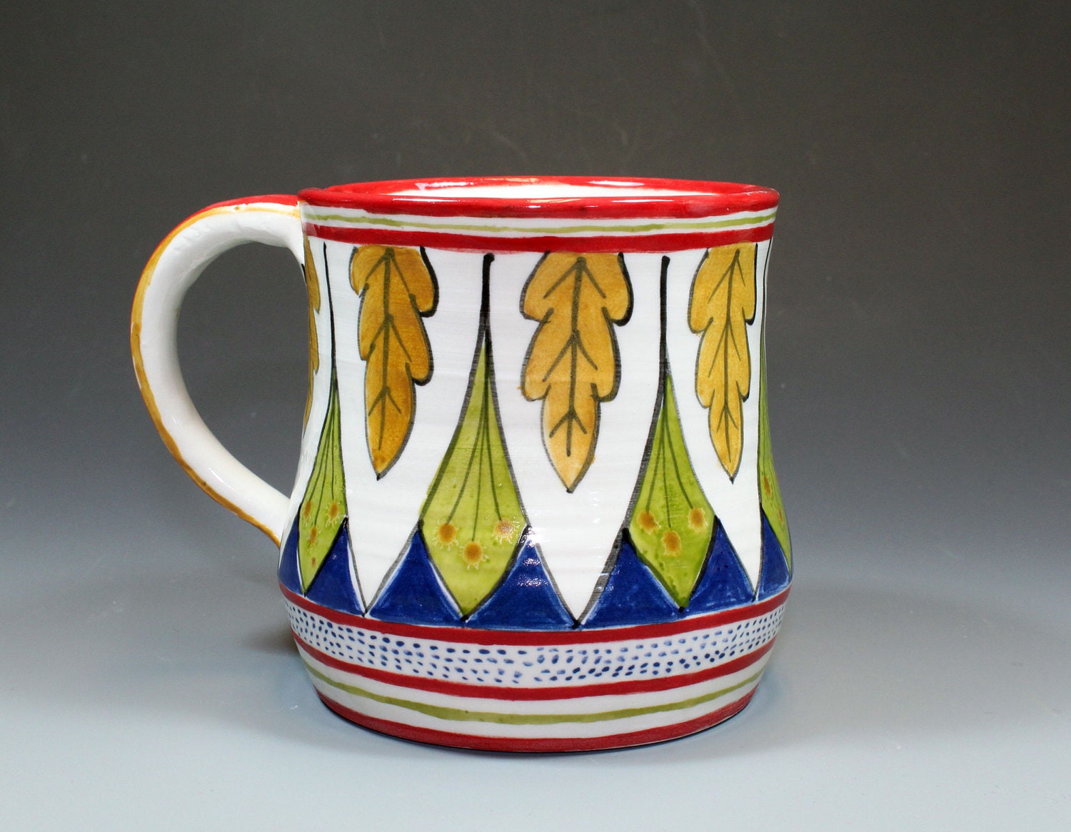 Pair of Mugs with gold leaves.