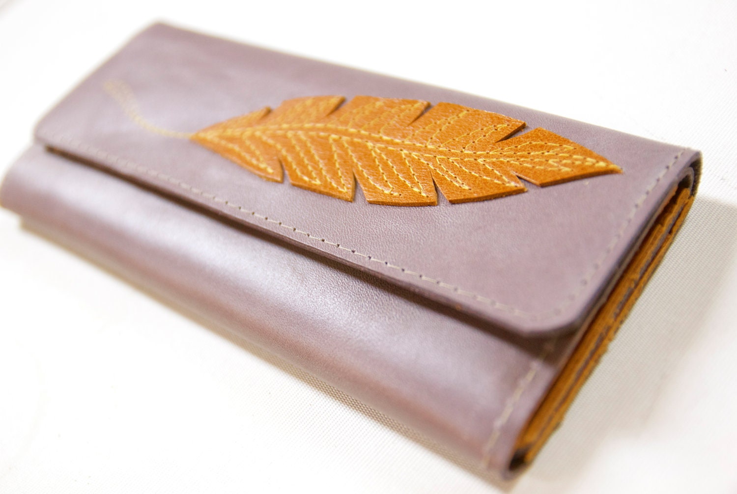 Leather Wallet with a Golden Feather