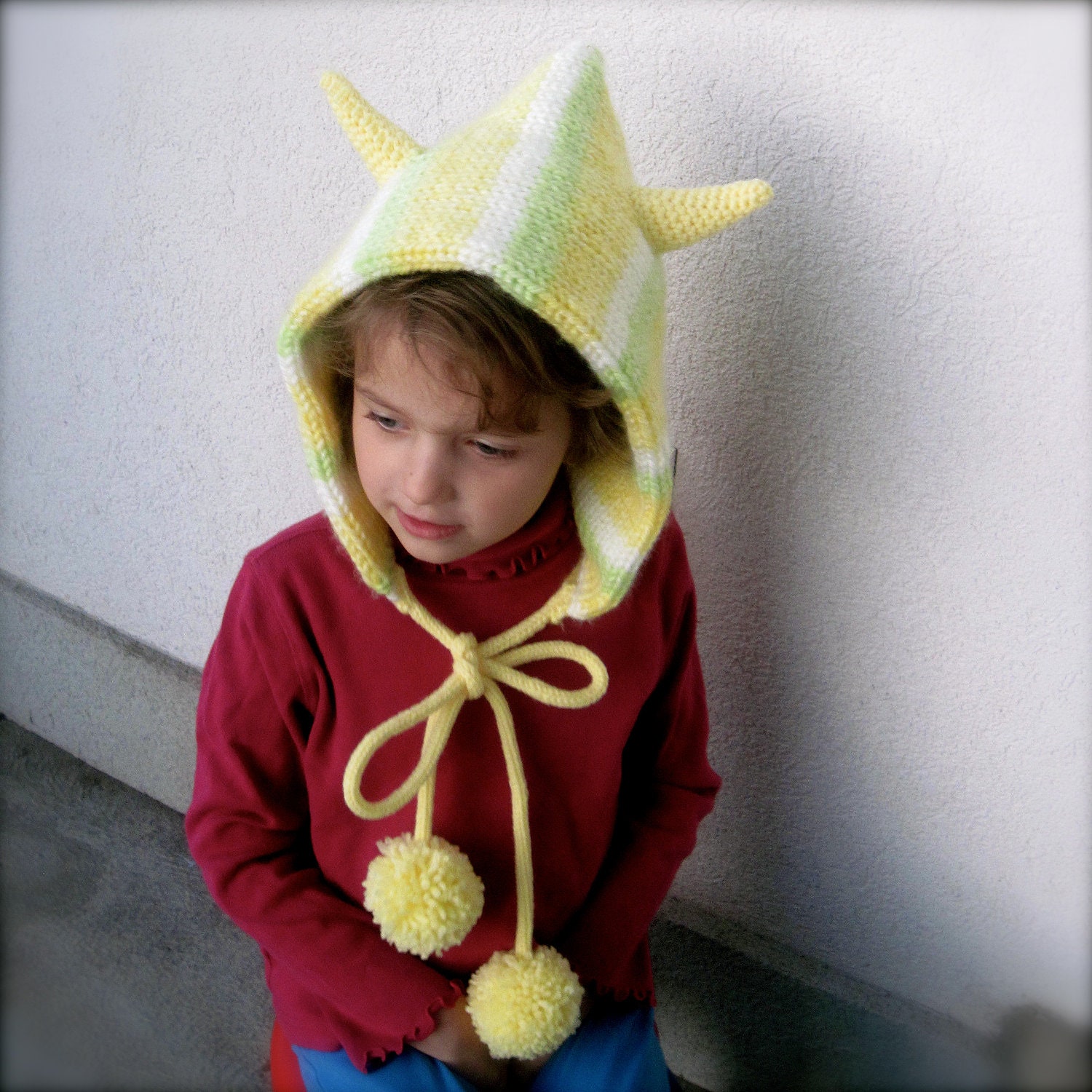 child's knit pixie hood with yellow horns
