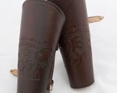 Dark brown leather bracers with an embossed celtic piglet armor cuff armour