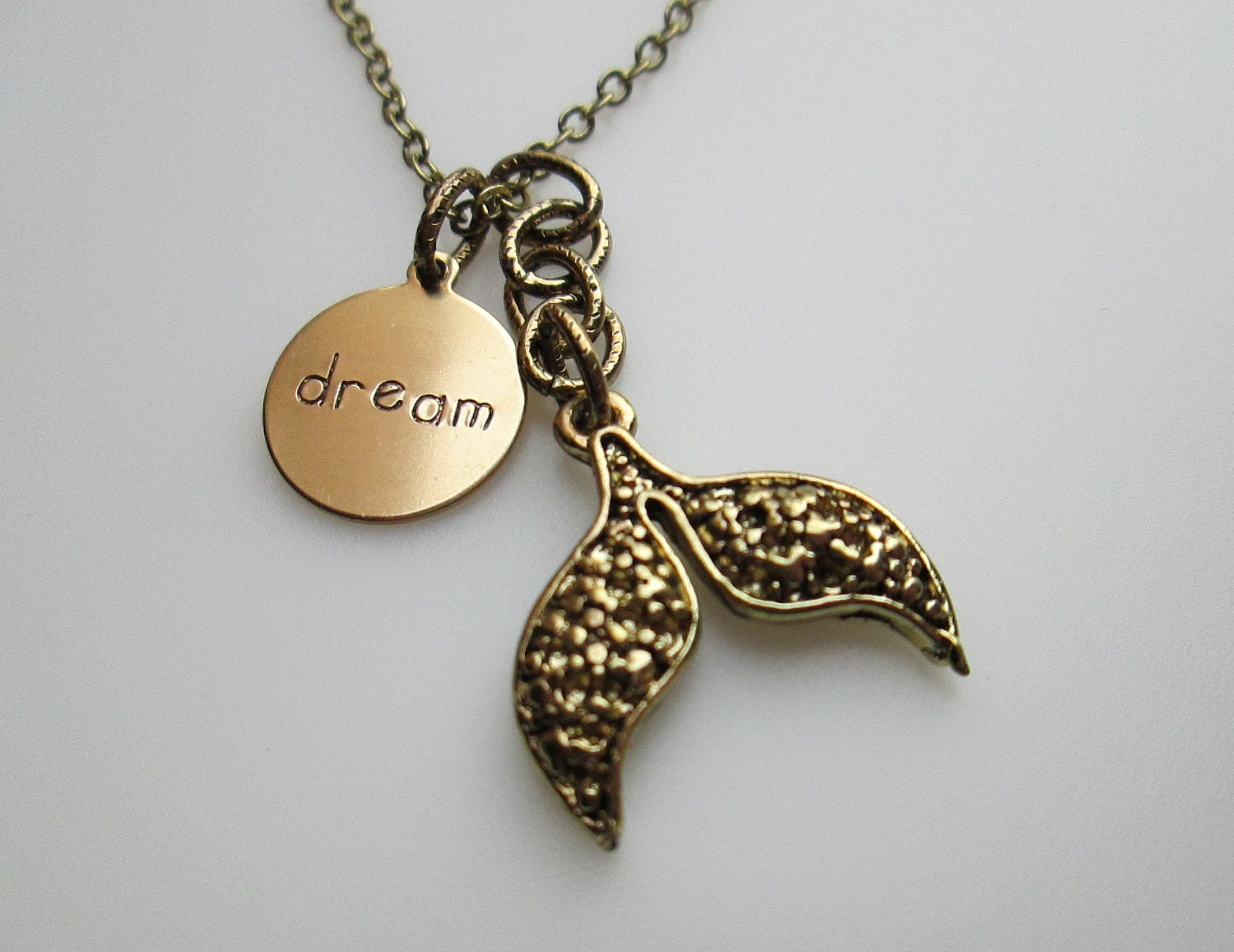 MERMAID TAIL. DREAM Word Pendant and Mermaid's Tail Charm Necklace in Antique Gold Brass Finish.