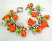 Charm bracelet, vintage style, glass flower charms, orange and lime green, citrus