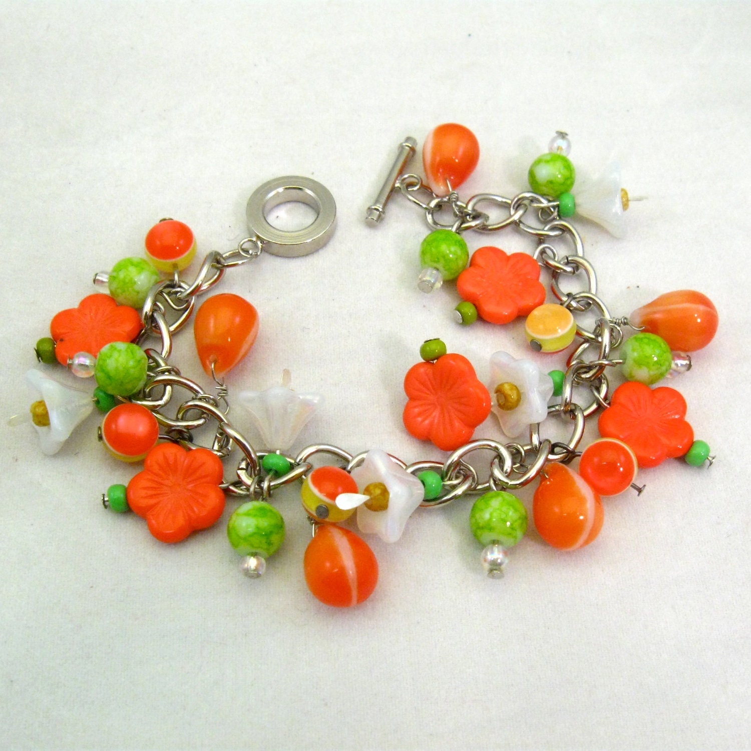 Charm bracelet, vintage style, glass flower charms, orange and lime green, citrus
