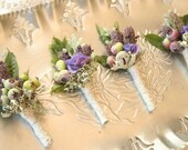 Boutonnieres, blueberries, purple hydrangea, lavender, dusty miller and wisteria foliage.
