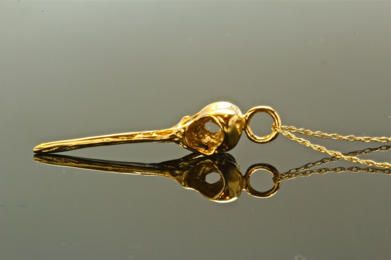 14k solid gold hummingbird skull pendant on an 18 inch 14k solid gold matching chain made in NYC USA