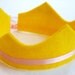 eco friendly lexa felt crown with adjustable ribbon tie. avail in 22 felt colors as seen on glo.msn & dailycandy.com.