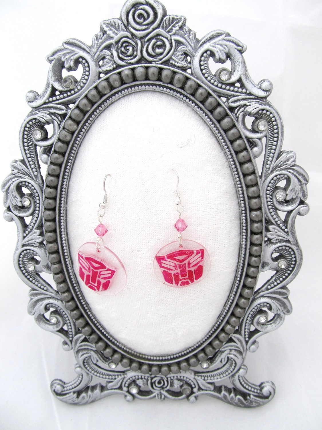 Pink Autobot symbol earrings