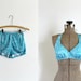vintage 1960s bikini 60s turquoise blue floral polka dot two piece nylon bathing suit aqua teal white flowers deadstock NOS