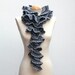 Grey flounced crochet scarf