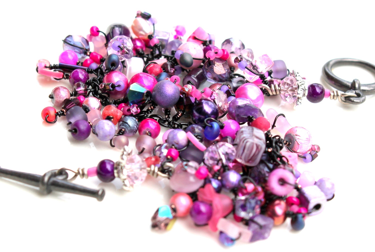 goth girl bracelet. pink and purple beaded jewelry.black wire wraps