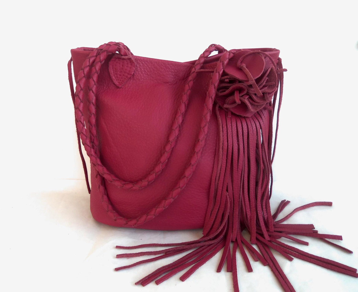 This  red leather handbag  tote with fringe and flower by Tuscada. Made to order