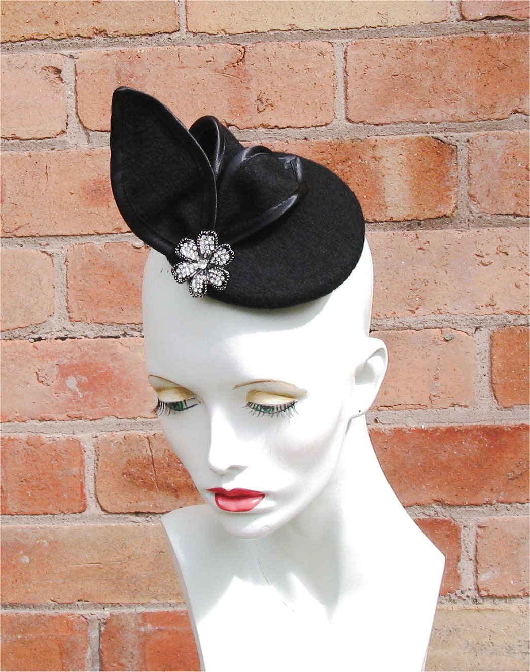 Black cocktail fascinator hat with diamonte flower