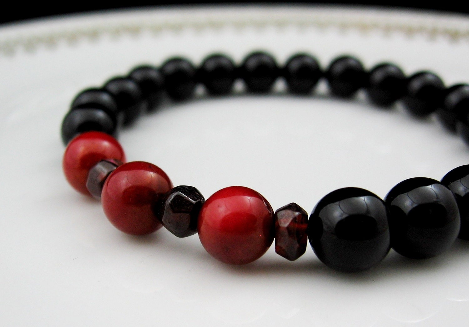 Chakra Energy Bracelet - First Chakra - Black Onyx, Red Bamboo Coral, and Garnet - by We Are 1