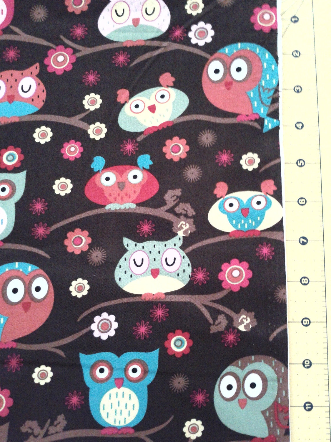Owls on a branch novelty Fabric