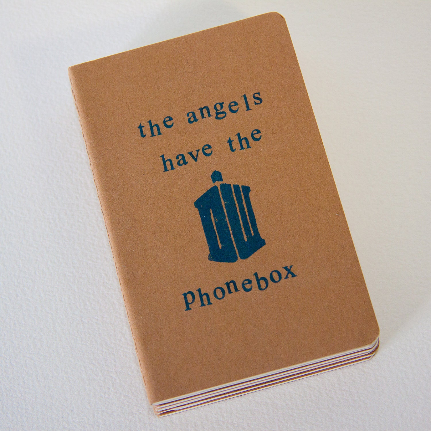 the angels have the phonebox - hand stamped moleskine notebook pocket size